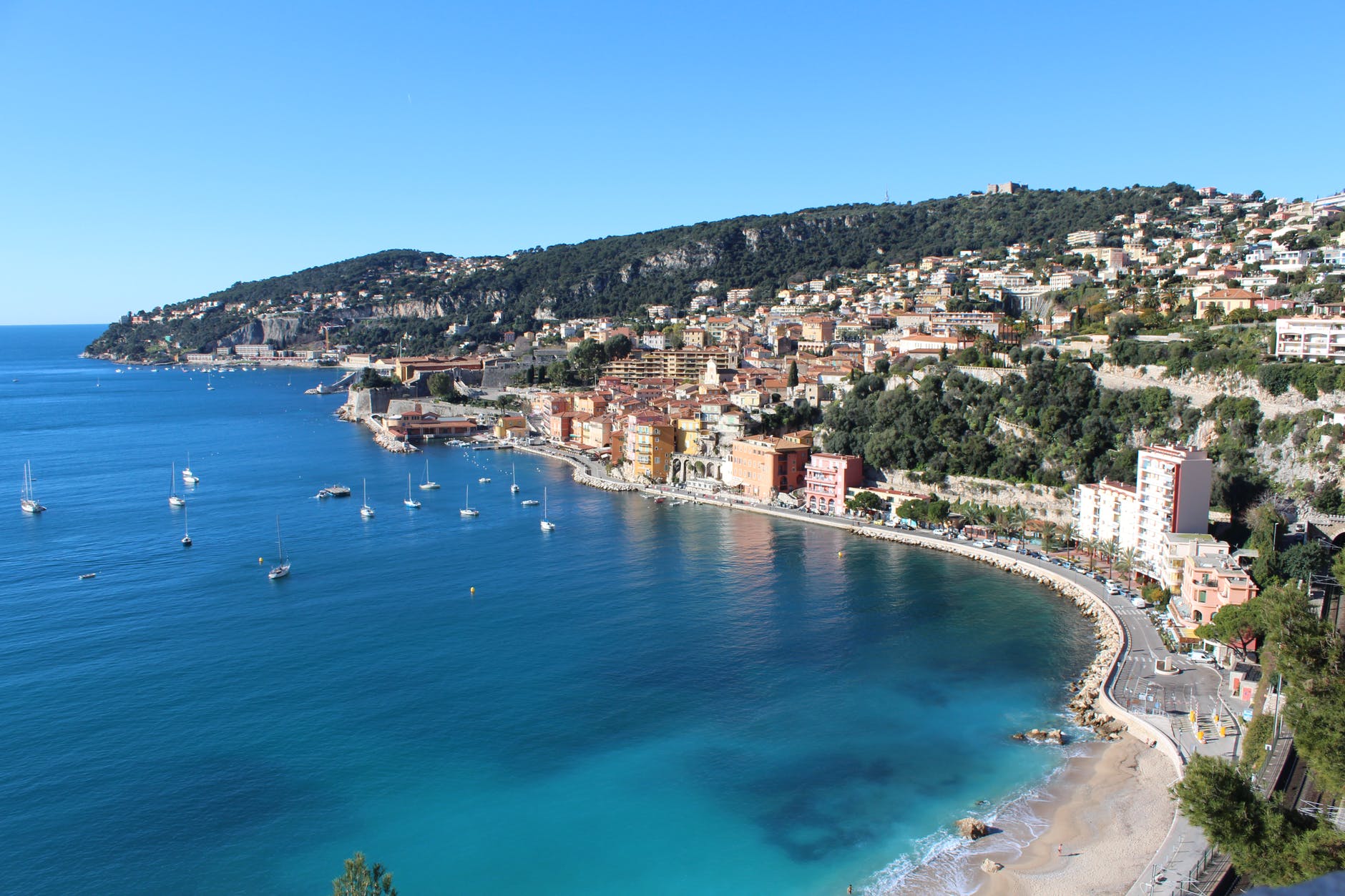 residential buildings in front of body of water during daytime