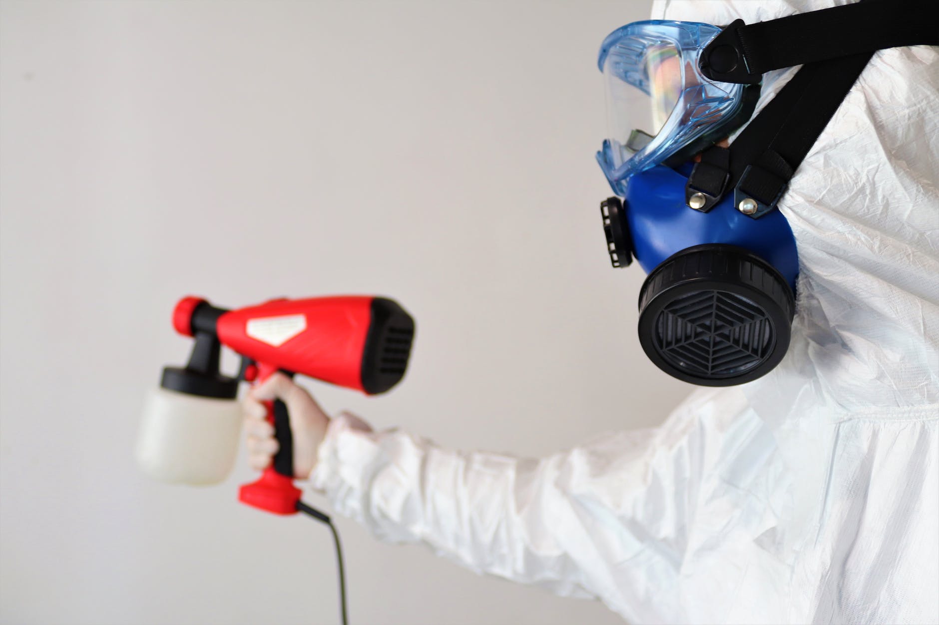 person disinfecting room