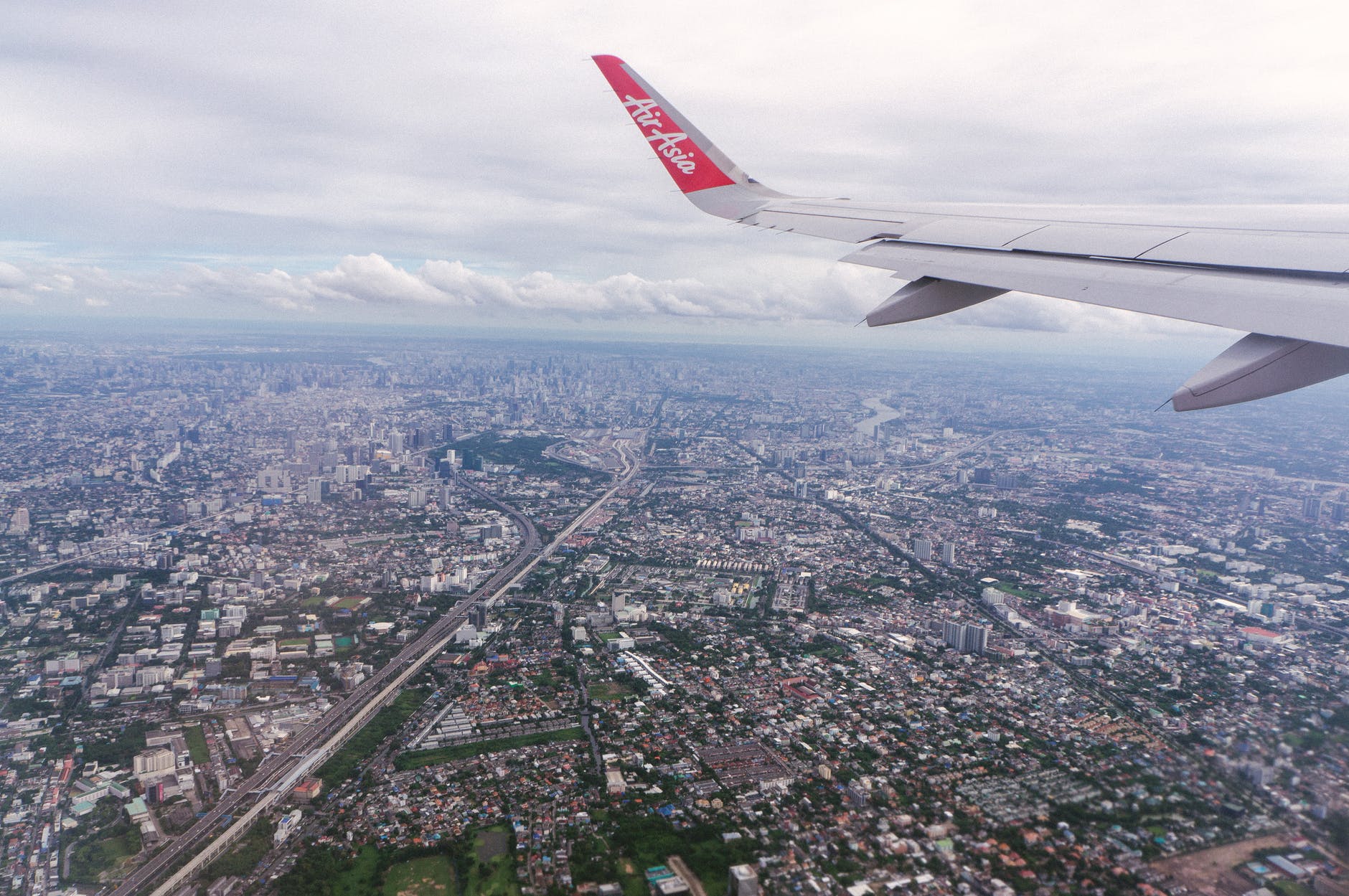 an airplane flying over a city