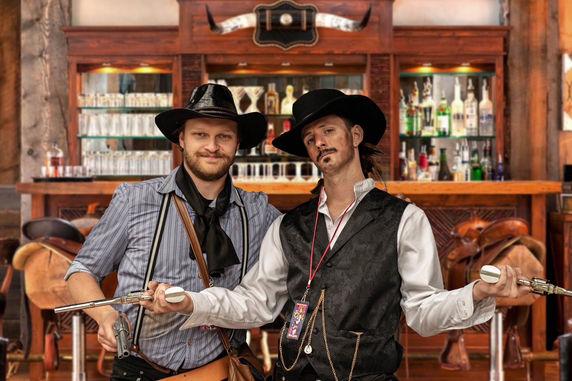 two men standing beside brown wooden cabinet