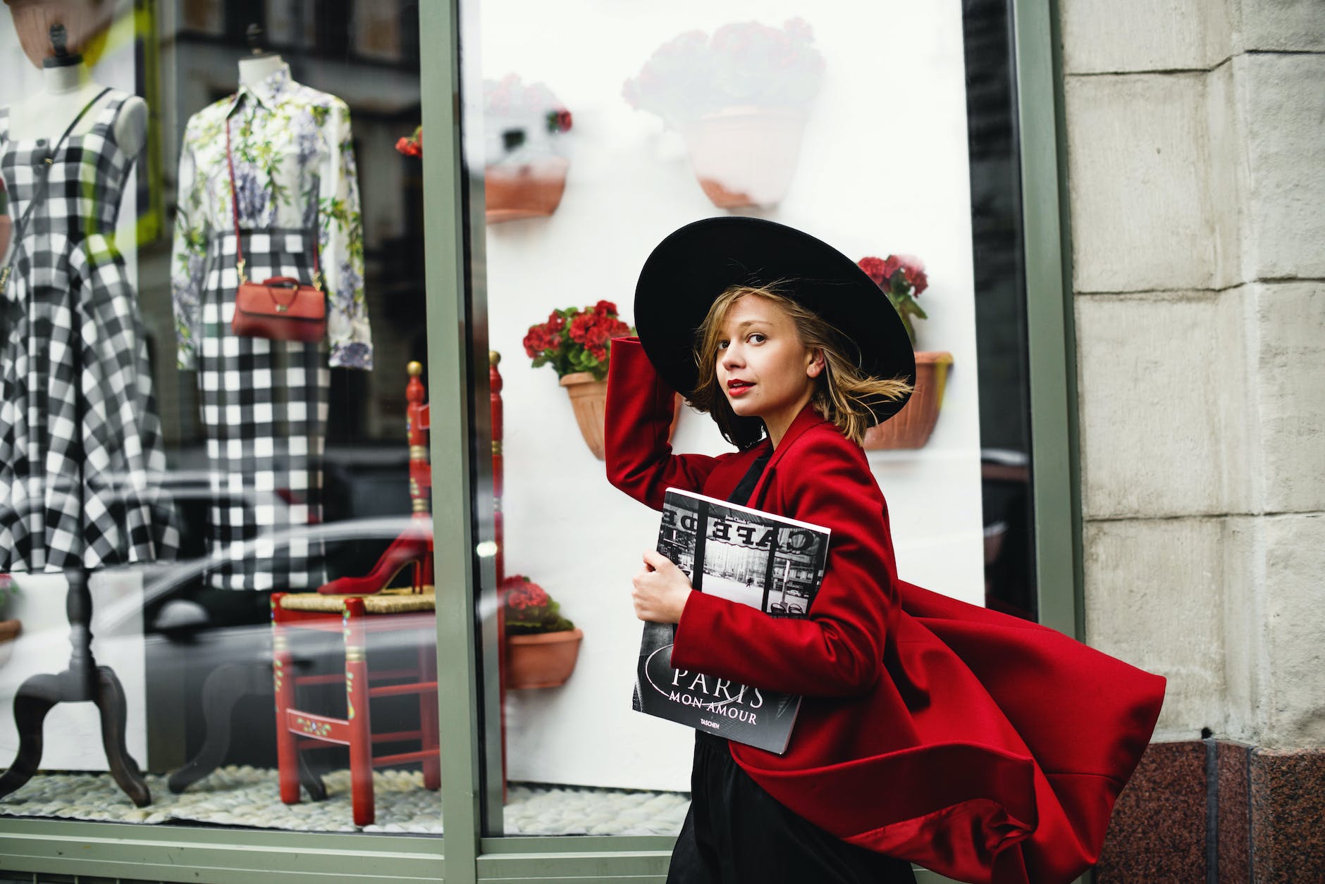 woman in Long red coat for ladies holding book